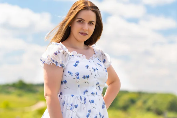 Attractive Busty Young Woman Floral Dress Standing Outdoors Lush Green — Stockfoto