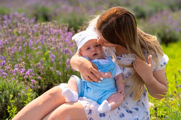 Young Mother Cuddling Her Cute Baby Son Outdoors Field Lavender — Fotografia de Stock