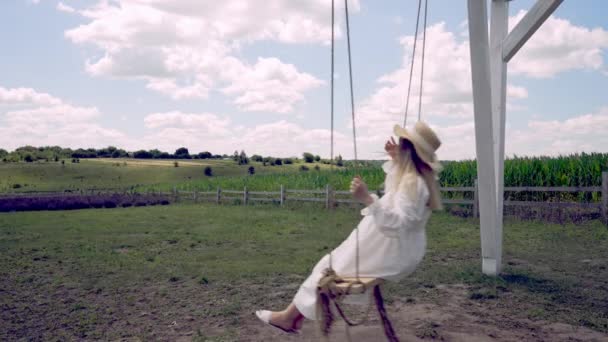 Young Woman Swinging Swing Outdoors Dusk View Green Maize Fields — Stock video