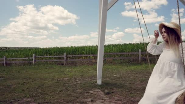 Young Woman Stylish Summer Oufit Sitting Swing Outdoors Rural Playground — Stock video