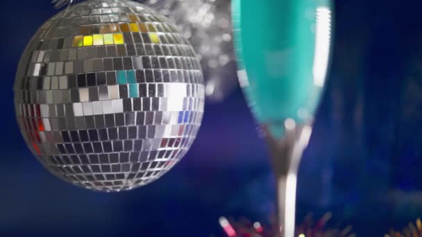 Silver Christmas Bauble Glass Sparkling Blue Champagne Matching Blue Background — Vídeo de Stock