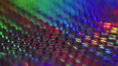 Bright vivid iridescent colors reflecting of an Xmas ornament in a full frame view to celebrate the holiday season and Christmas