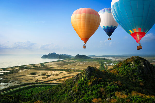 Hot air balloons floating up to the sky