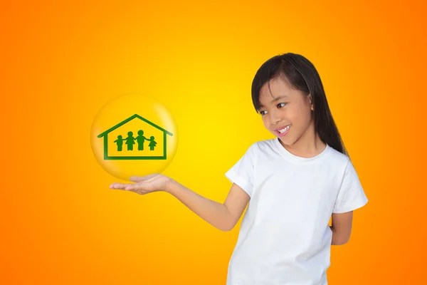 Smiling little girl showing on family symbol — Stock Photo, Image