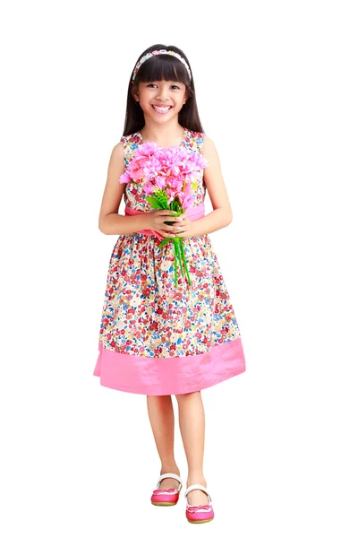 Hermosa chica asiática joven en un vestido con una flor en la mano —  Fotos de Stock