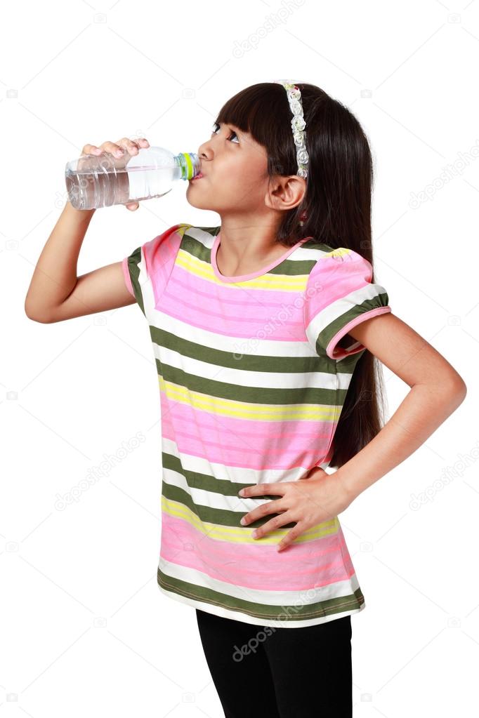 Little asian girl drinking water