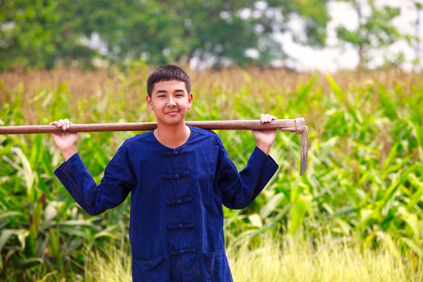 Teenager boy in thailand'ss agriculturist dress — Stock Photo, Image