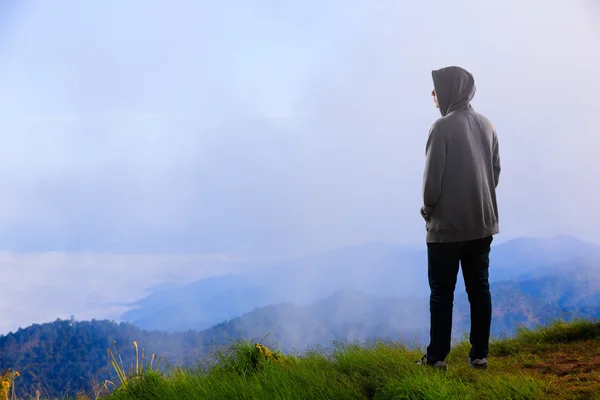 Teenager asian boy standing at mountain — Stock Photo, Image