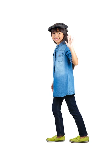 Smiling asian little girl in the action of walking — Stock Photo, Image