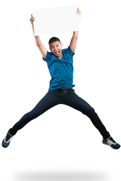 Teenager boy jumping and holding blank paper — Stock Photo, Image