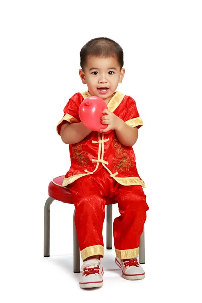 Little asian boy in traditional chinese cheongsam — Stock Photo, Image