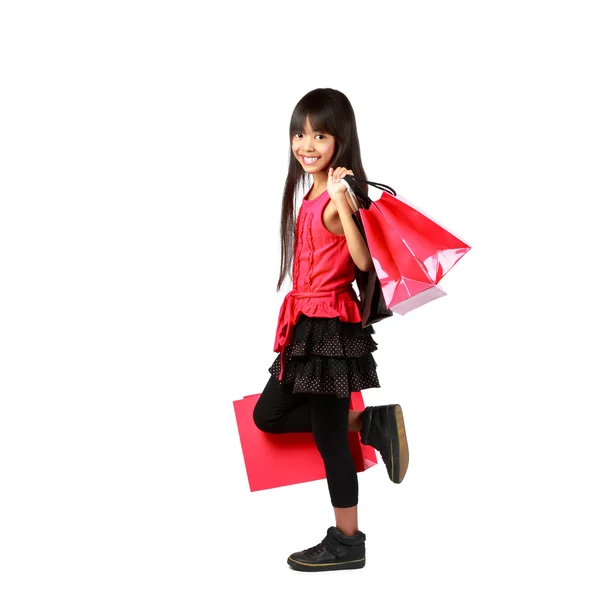 Little asian girl with shopping bags — Stock Photo, Image