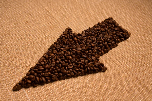 Seta dos grãos de café isolados na serapilheira — Fotografia de Stock