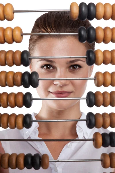 Girl holds in front of abacus — Stock Photo, Image