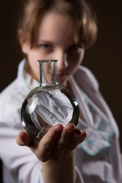 Girl white lab coat with flask — Stock Photo, Image