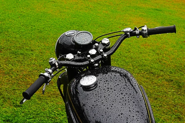 Black wet vintage motorbike — Stockfoto