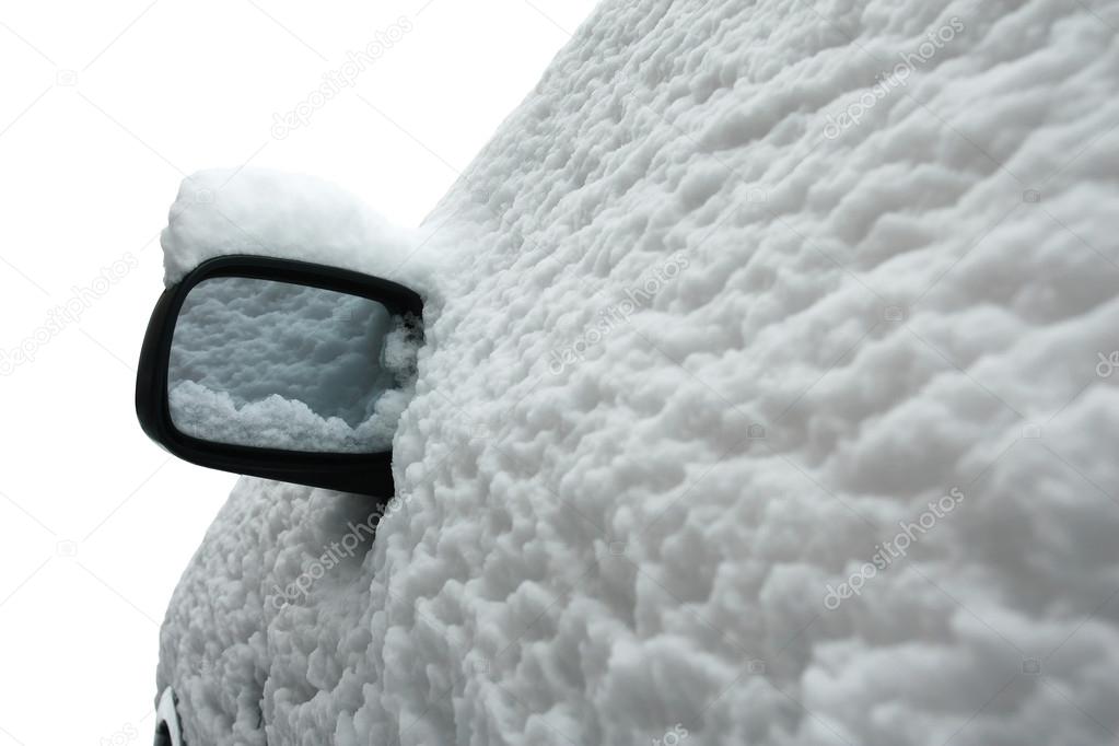 Snow covered car in winter