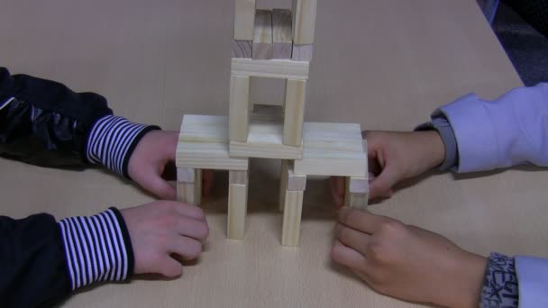 Kids breaking toy block construction — Stock Video