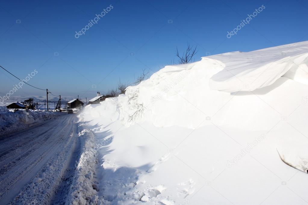 Snowbound rural road in winter