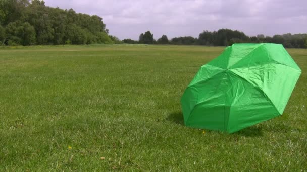 Broken umbrella blown by wind away — Stock Footage Broken umbrella blown by wind away Royalty Free Stock Video