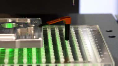  Precision measurement machine table with fixed complex part on it moving in different directions while the detail is being measured by sophisticated system of sensors.