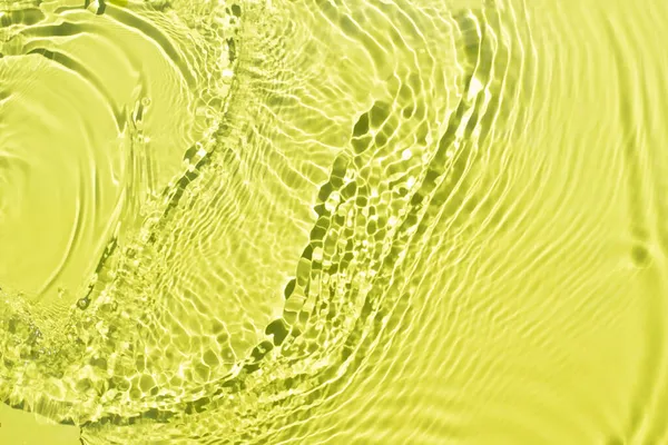Aqua golven op een licht groene achtergrond. Licht en schaduwen. — Stockfoto