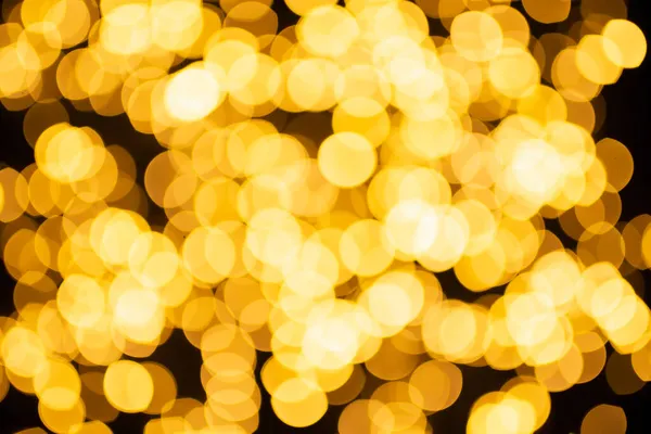 Prachtige natuurlijke bokeh van de gele lichten. Abstract Kerst Nieuwjaar achtergrond voor tekst of reclame. — Stockfoto