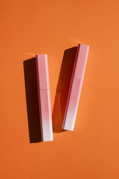 Lip Gloss Pink White Gradient Case Top View Orange Background — Stock Photo, Image