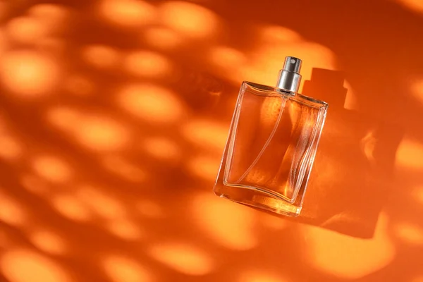 Transparent Bottle Perfume Orange Background Fragrance Presentation Daylight Trending Concept — Stock Photo, Image