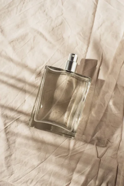 Transparent Bottle Perfume Light Grey Fabric Background Fragrance Presentation Daylight — Fotografia de Stock