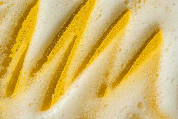 Foam Yellow Background Soapy Liquid Shower Gel Shampoo Swatches Texture — Fotografia de Stock