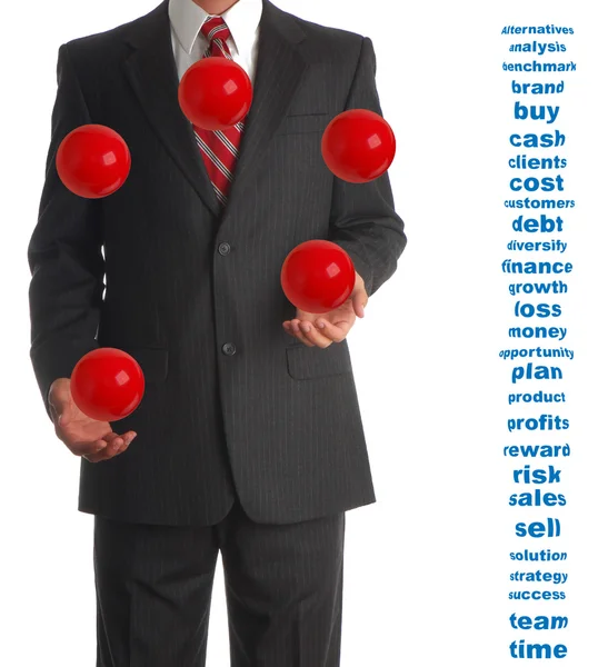 Жонглирующий бизнесмен — стоковое фото