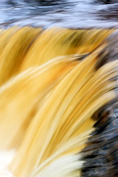 Yellow waterfall — Stock Photo, Image