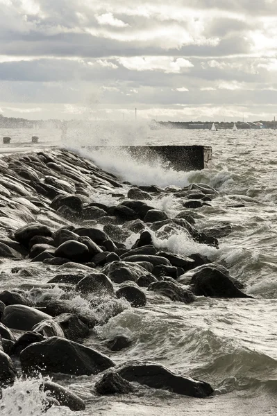 Pier in turbulent and stormy sea — Stock Photo, Image
