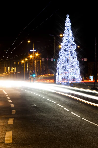 Christmas decoration and car lights — Stock Photo, Image