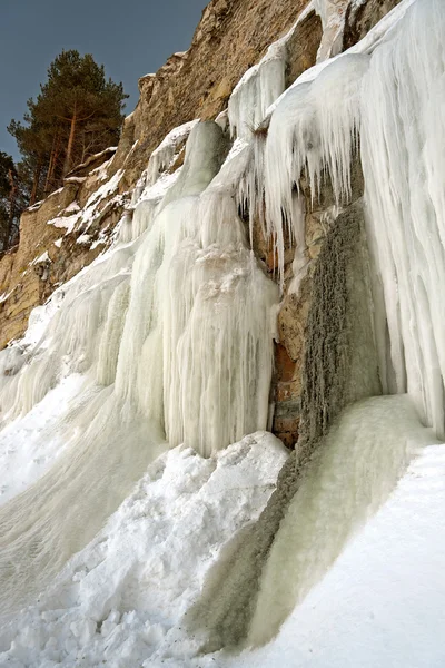 Tall icicles on a cliff — Stock Photo, Image