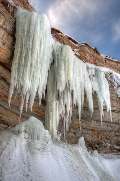 Tall icicles on a cliff — Stock Photo, Image