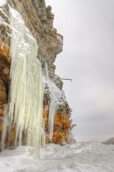 Tall icicles on a cliff — Stock Photo, Image