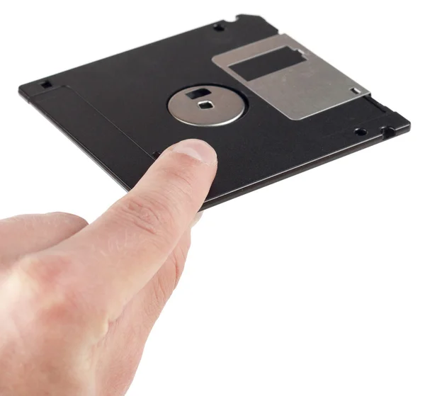 Floppy disk between fingers — Stock Photo, Image