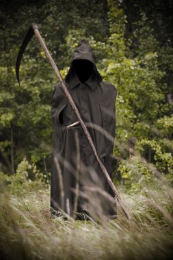 Death standing with scythe on hand clipart