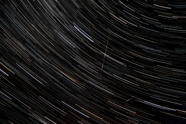 Star trails and falling perseid in the sky — Stock Photo, Image