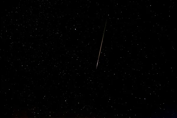 Falling star known as perseid in the sky