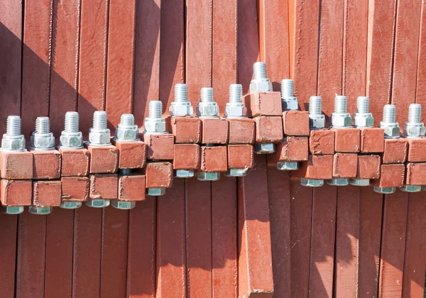 Bolts inside red objects — Stock Photo, Image