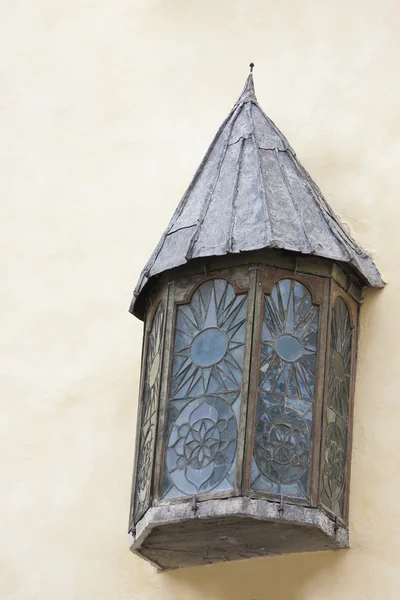 Ancient window with a roof in a wall — Stock Photo, Image
