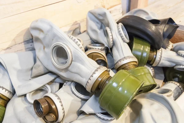 Many gas masks in a chest — Stock Photo, Image