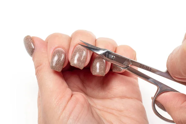 Woman Cuts Nails Scissors White Backdround Close — Stock Photo, Image