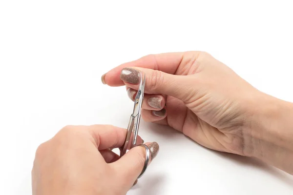 Woman Cuts Nails Scissors White Backdround Close — Stock Photo, Image