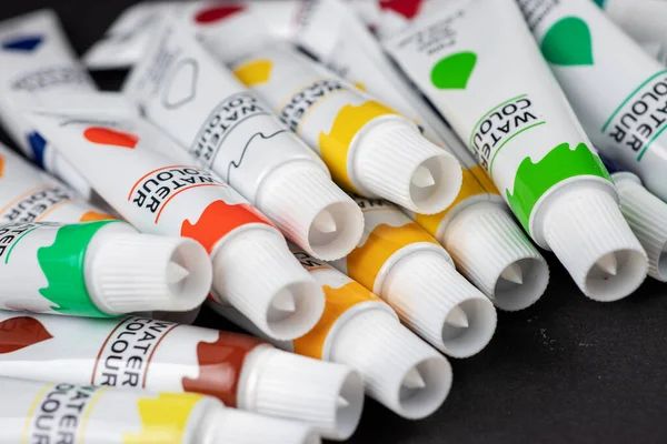 Colorful Acrylic Paints Tubes Dark — Stock Photo, Image