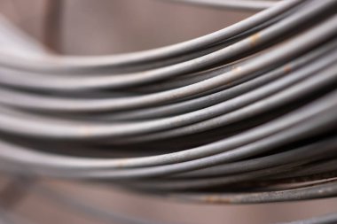 Stainless Steel wire Rolls in the construction site. Closeup of Metal Steel reinforced rod for concrete in store