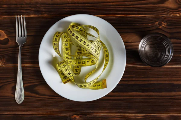 Diet Concept Empty Plate Measuring Tape Fork Glass Watter Healthy — Zdjęcie stockowe